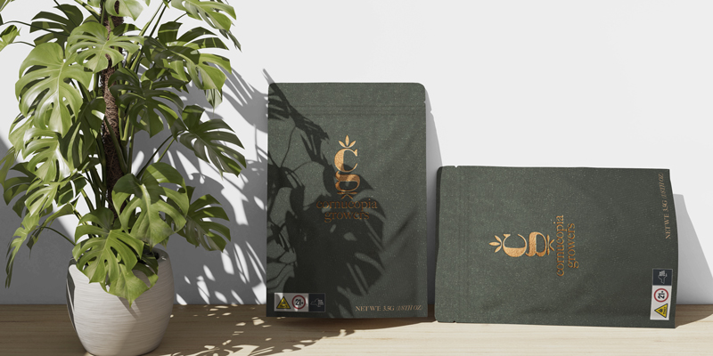 Custom cannabis packaging design for Cornucopia Growers featuring premium stand-up pouches and branded product boxes with embossed olive green finishes and copper foil logo details.