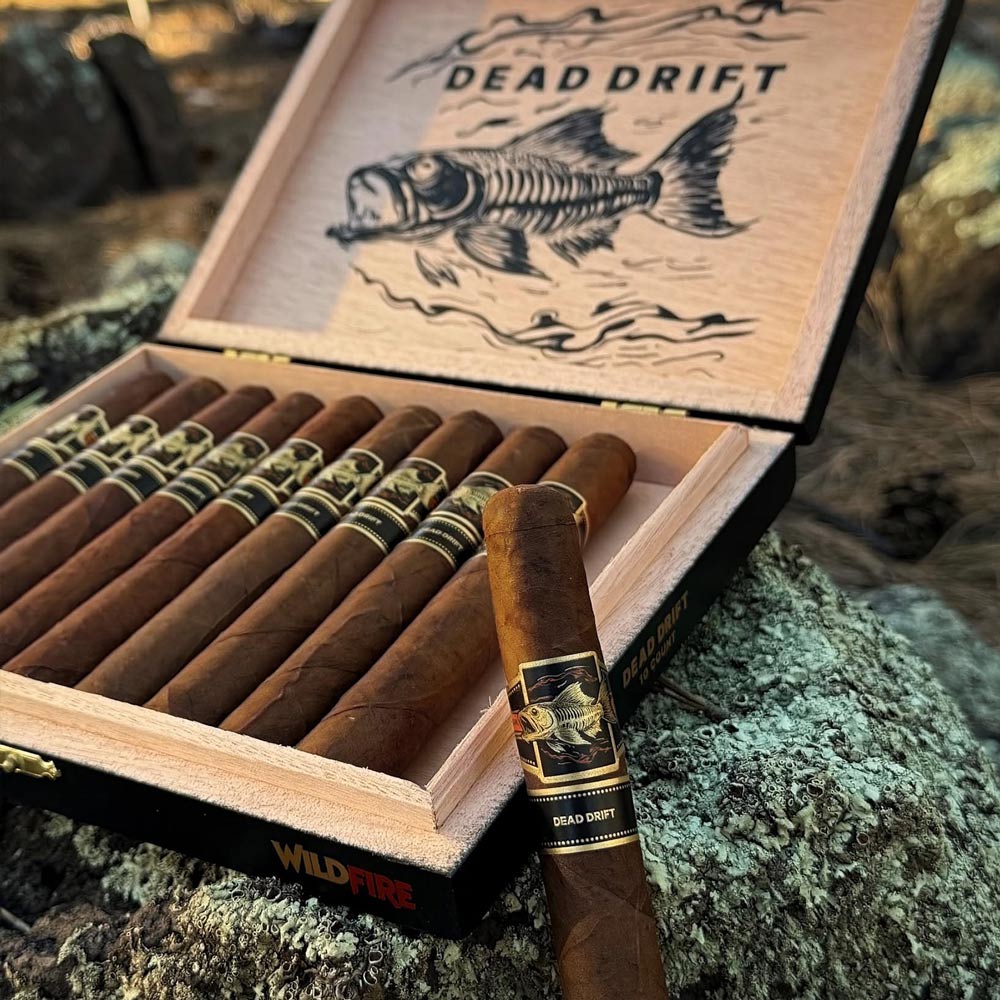 Premium cigar packaging design featuring custom cigar bands, illustrated box artwork, and cohesive product branding created by Hellbeing Agency for Wildfire Cigars.