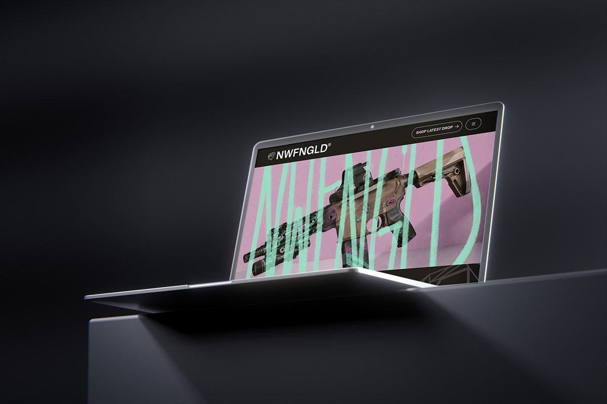 A laptop showing the NWFNGLD website homepage hero — a customized rifle on pink with mint graffiti.